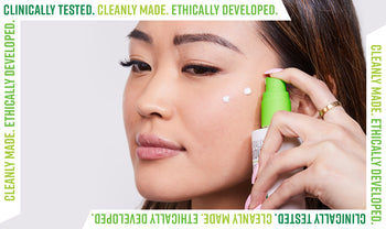 Woman applying Naturally Serious serum for glowing skin with text Cleanly Made. Ethically Developed. Clinically Tested.
